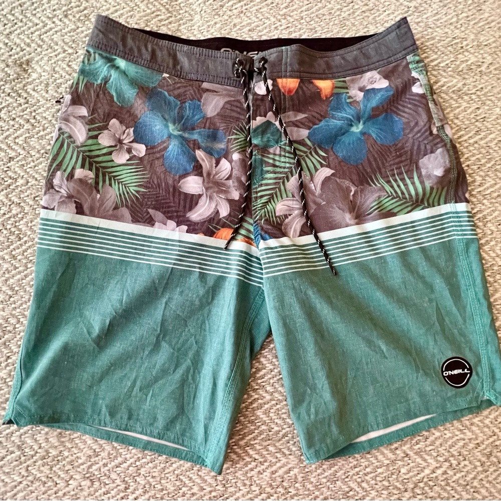 Gorgeous blue tropical board shorts by O’Nell. Worn once.